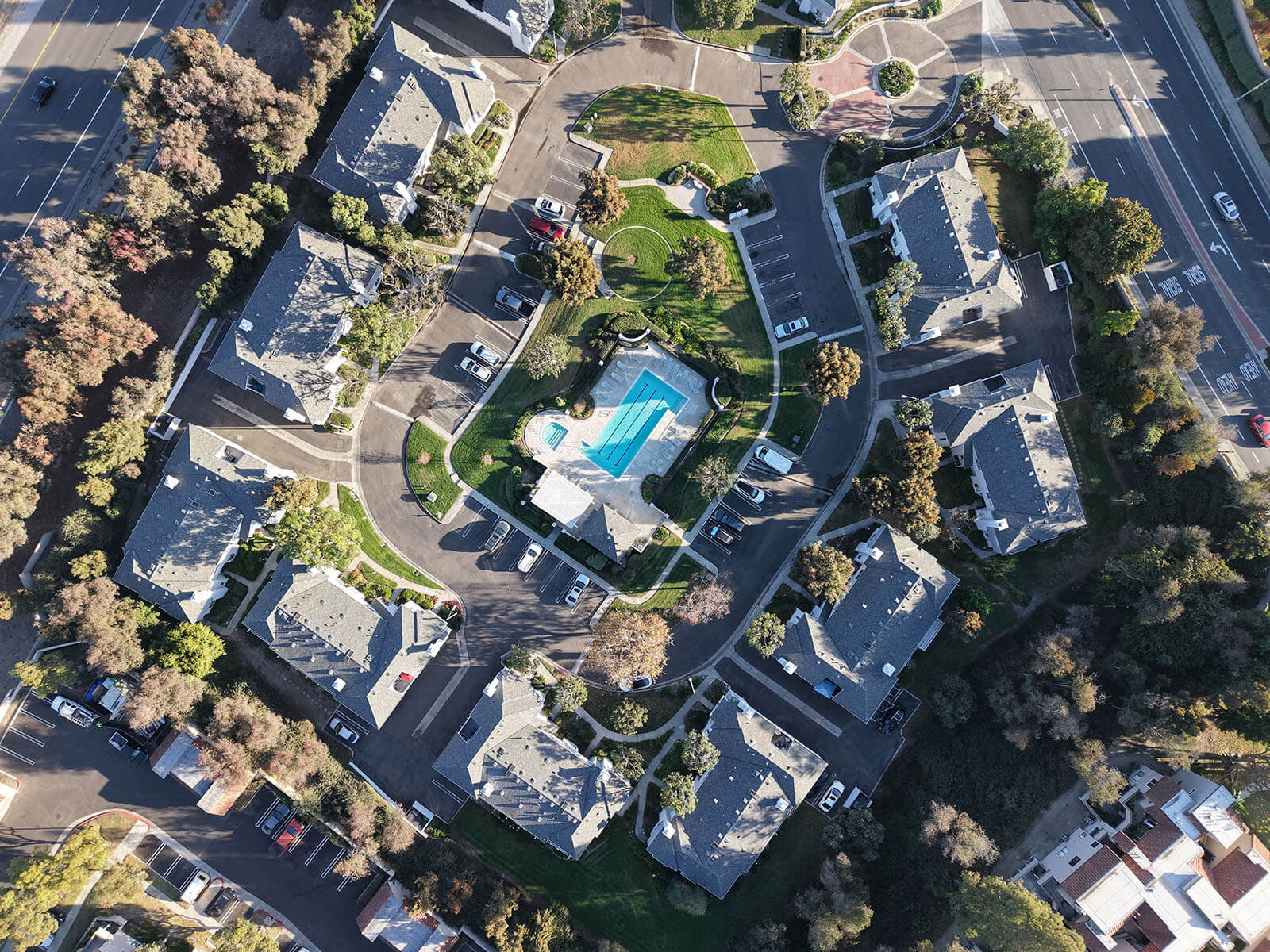 aerial view photo of condos with swimming pool