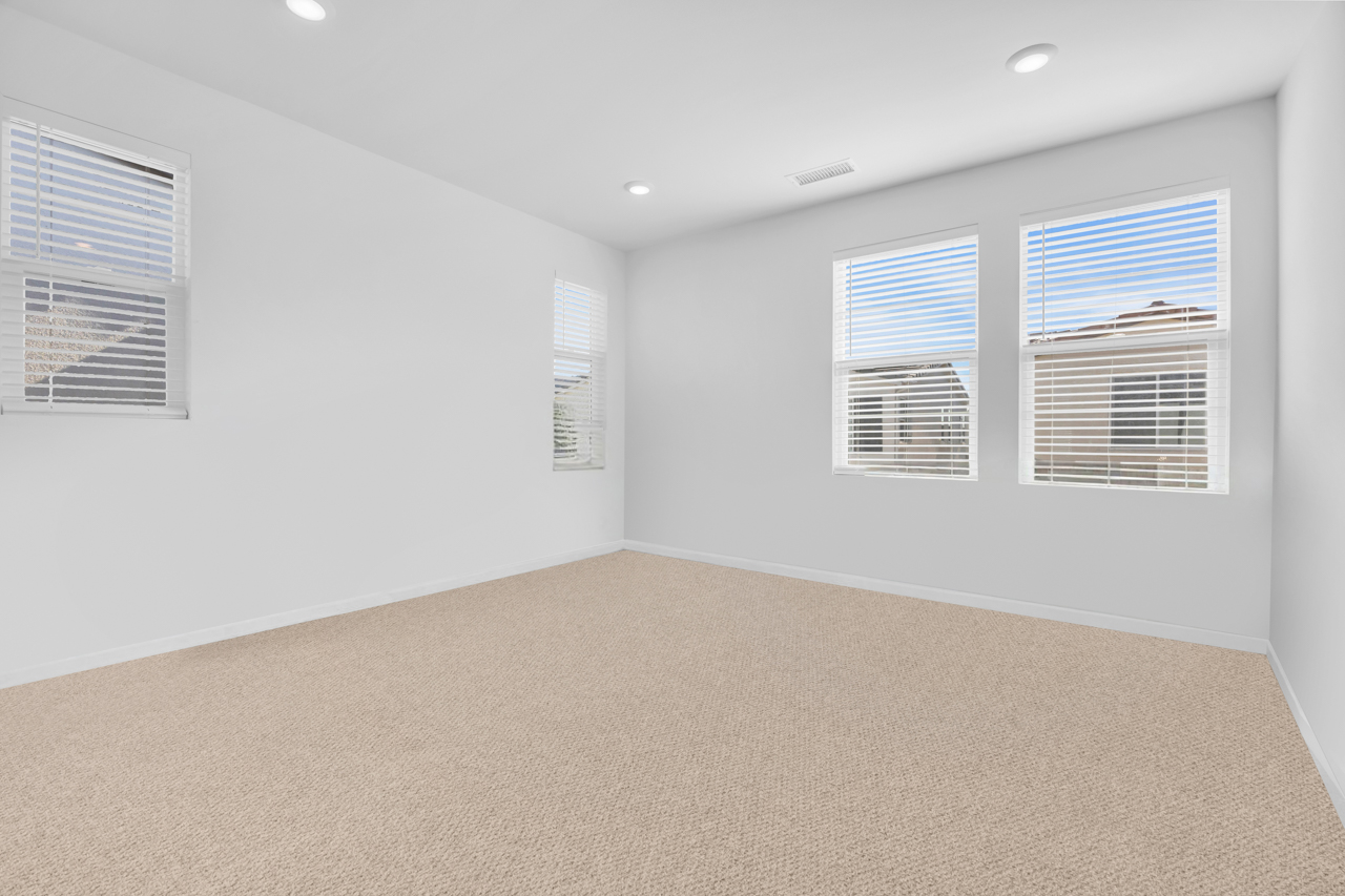 Interior of home with before virtual furniture staging services added